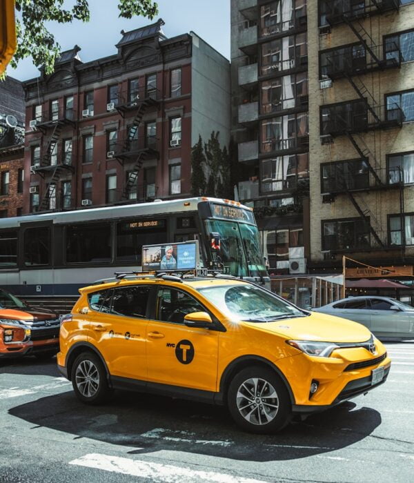 a yellow car on a street